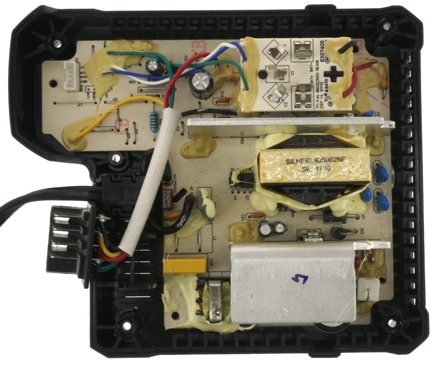 Milwaukee M18/M12 Rapid Charger Circuit Board Top Reverse Engineering Milwaukee 860323004 Rapid Charger with top cover removed showing top of circuit board